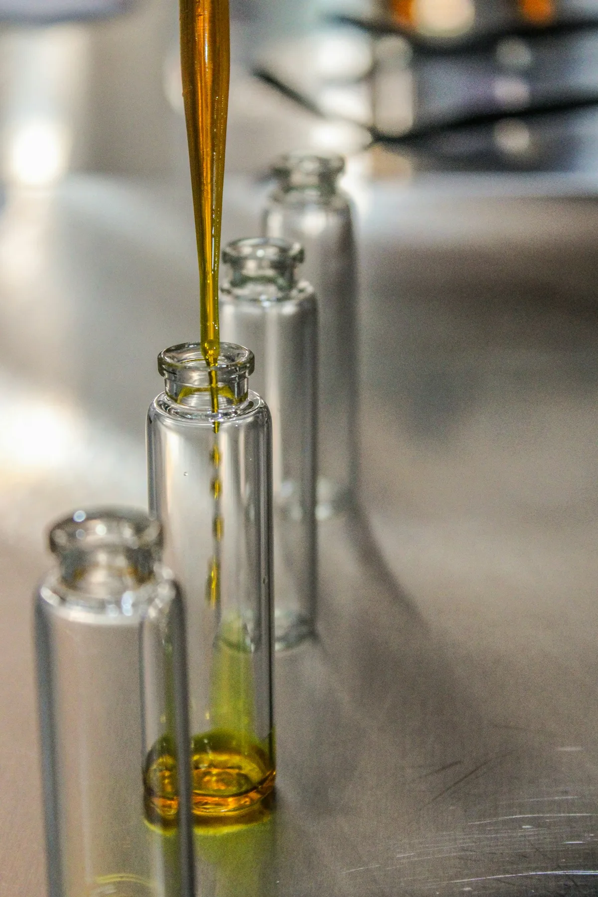 Golden olive oil being poured at the press